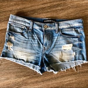 Low-rise distressed denim shorts. Size 8